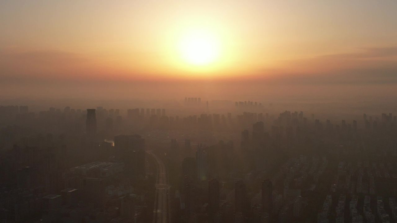 高楼迷雾清晨日出河南许昌航拍