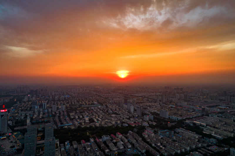 城市日落晚霞夕阳航拍摄影图山东济宁