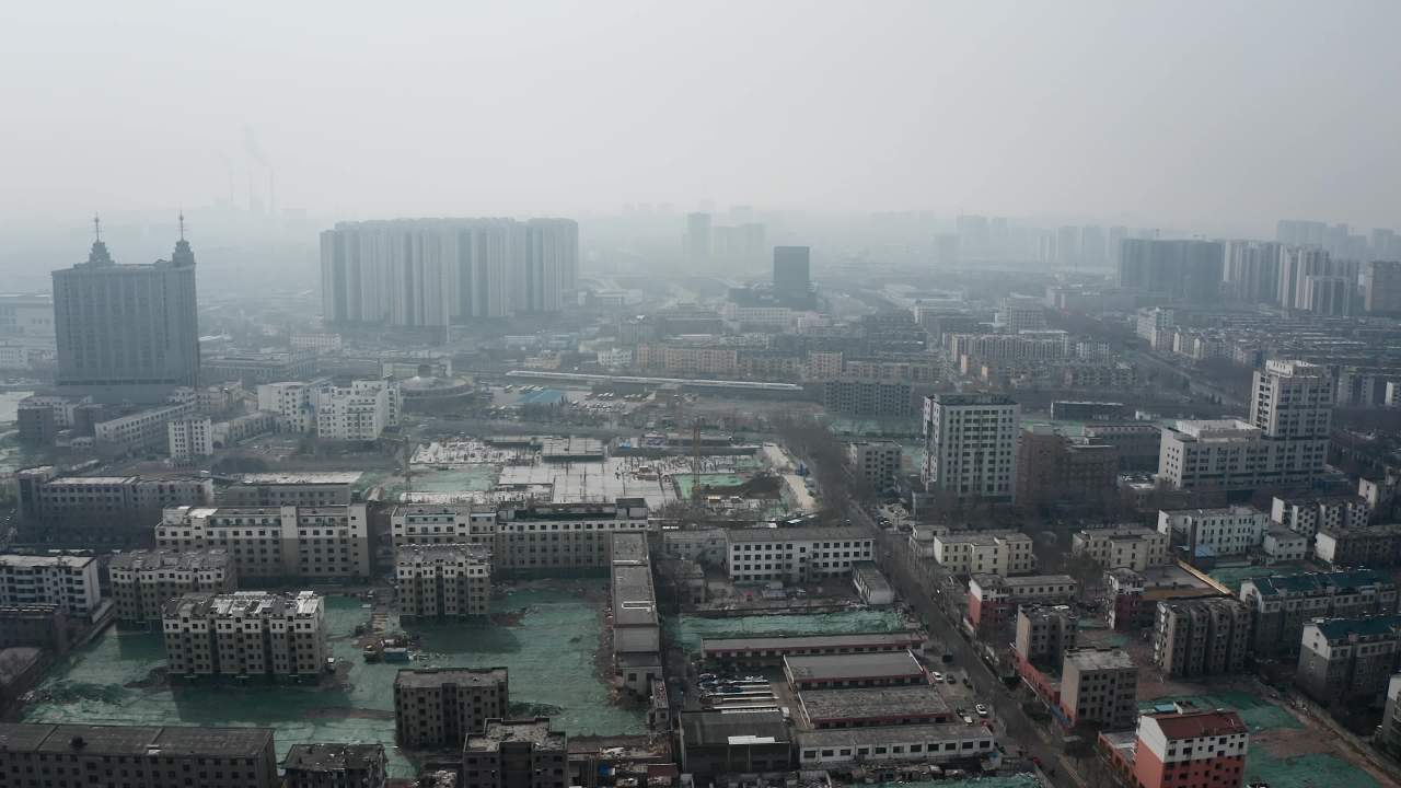 航拍高铁动车穿行在城市中