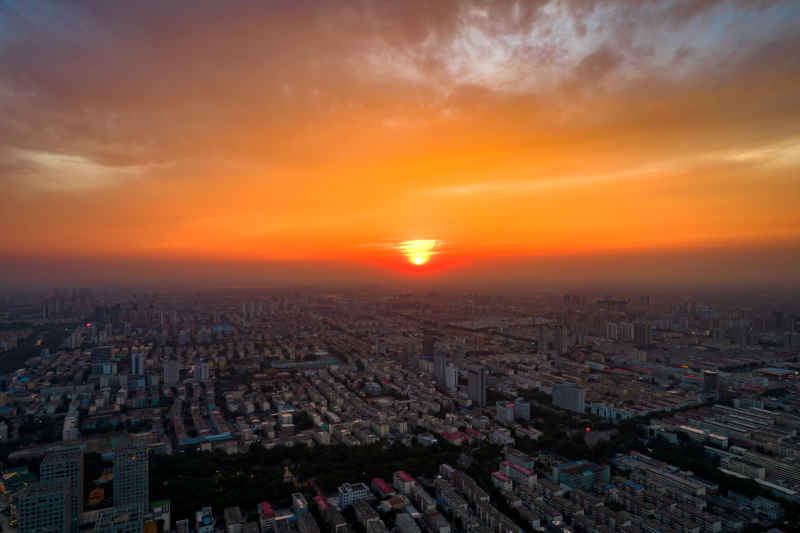 城市日落晚霞夕阳航拍摄影图山东济宁