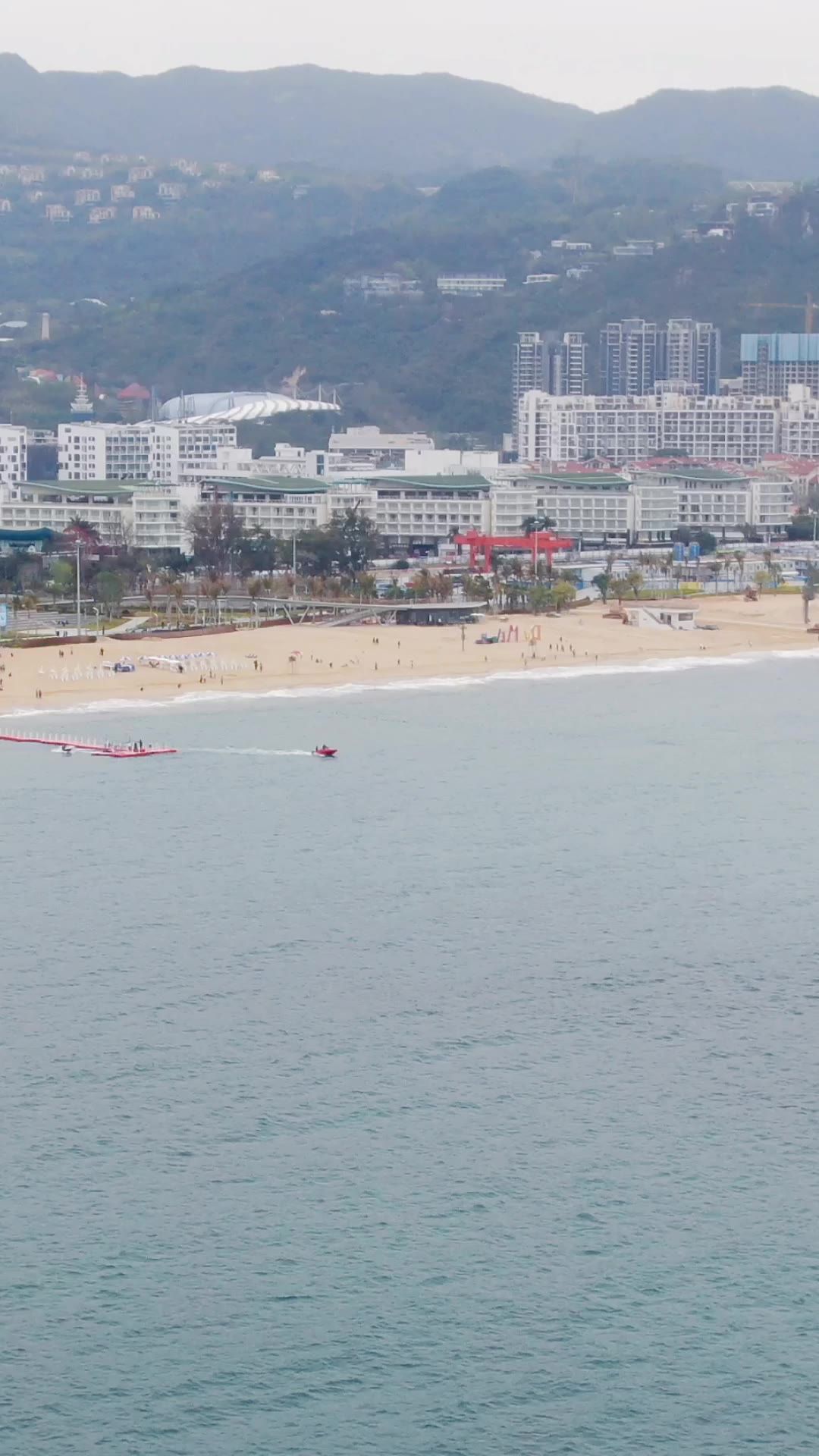  航拍蓝色海洋沙滩礁石海浪竖屏