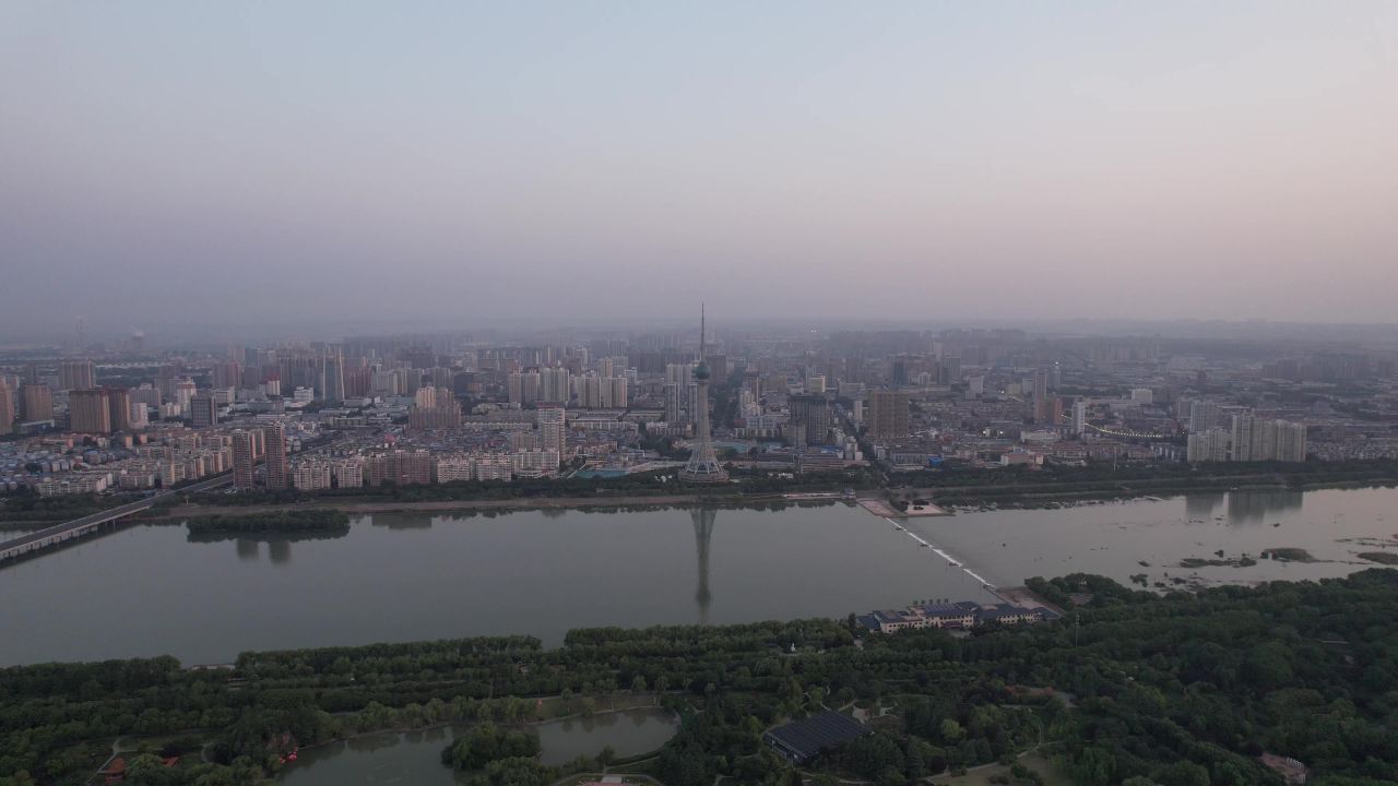 河南洛阳城市清晨日出彩霞航拍