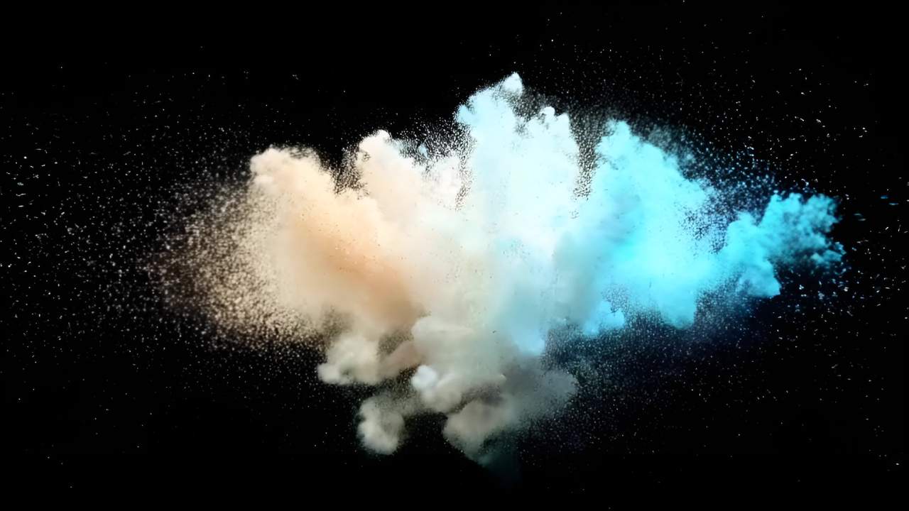 黑色背景下，呈现一团彩色粉末，颜色从左至右由浅橙色