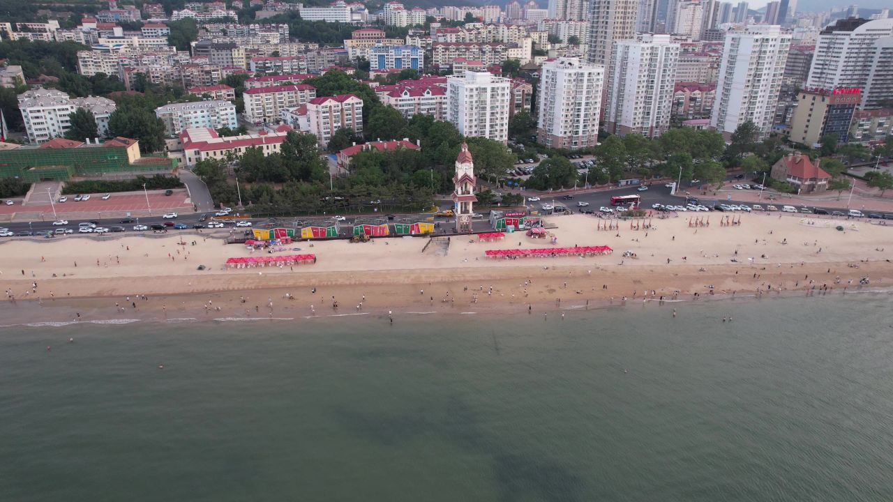 山东烟台城市风光沙滩大海游船航拍 