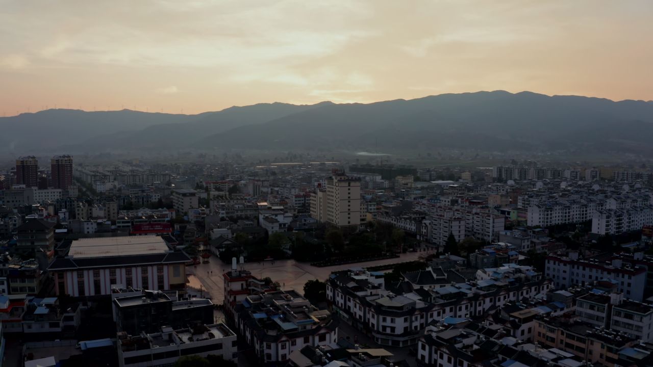 云南楚雄姚安县城市日出风光航拍延时