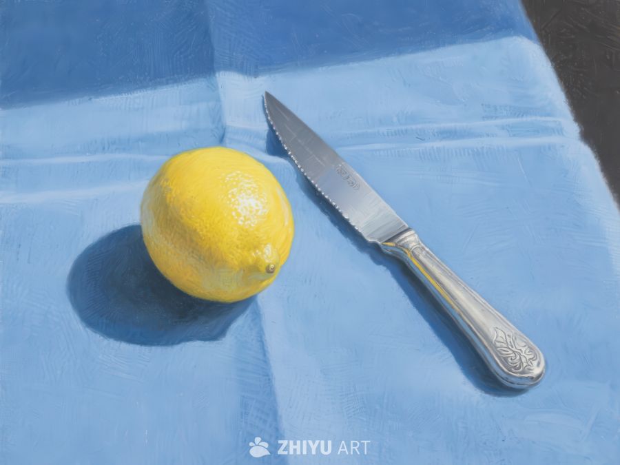 柠檬与刀置于蓝色布上 273
