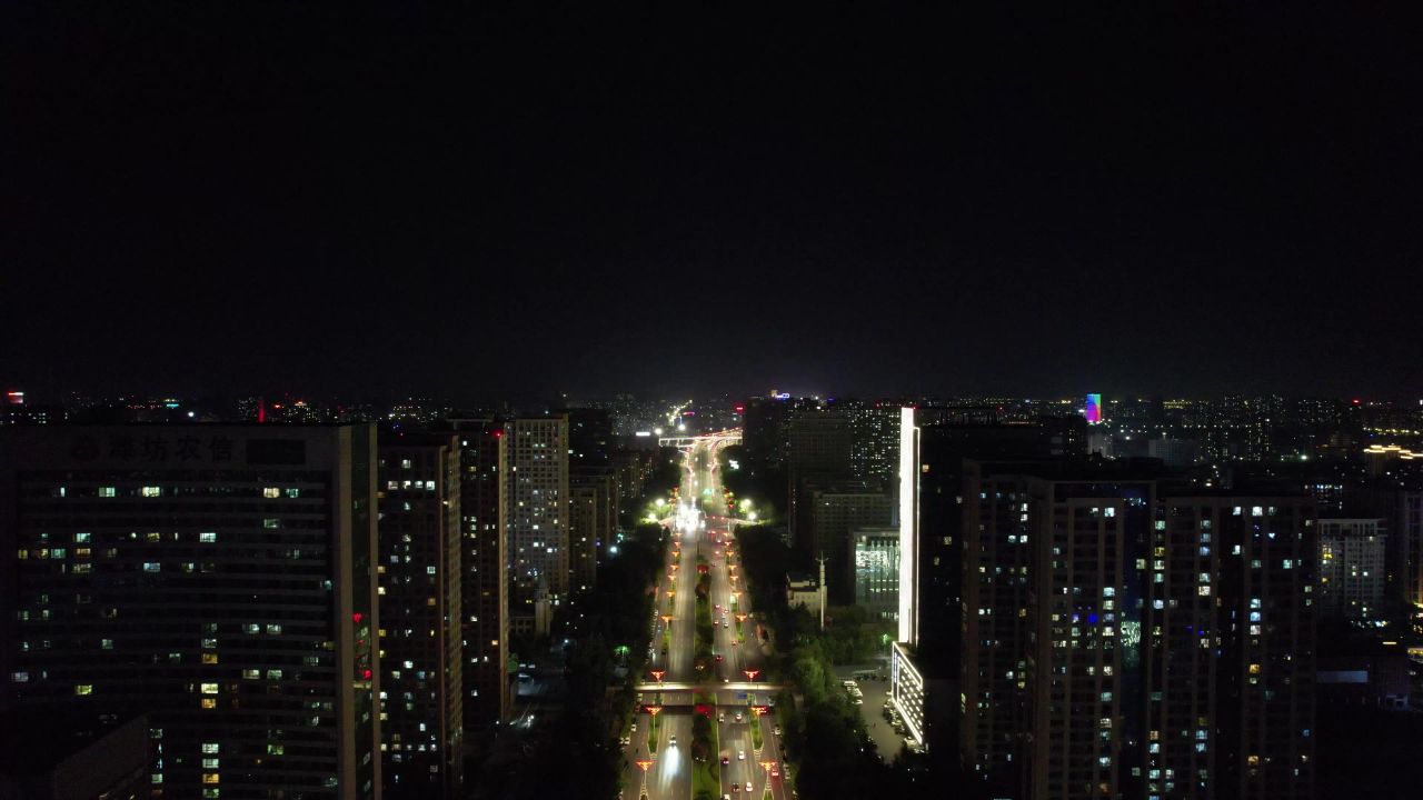 山东潍坊城市大道夜景交通车辆行驶航拍