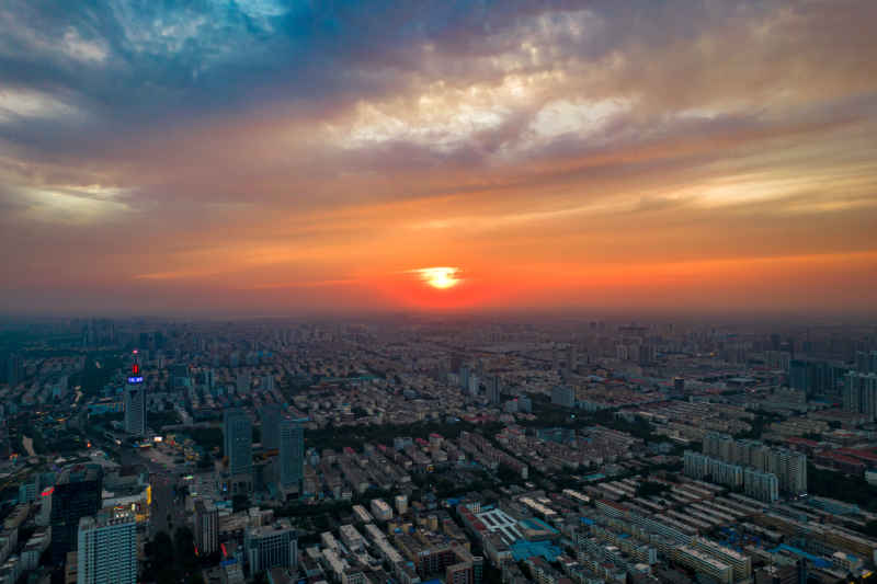 城市日落晚霞夕阳航拍摄影图山东济宁