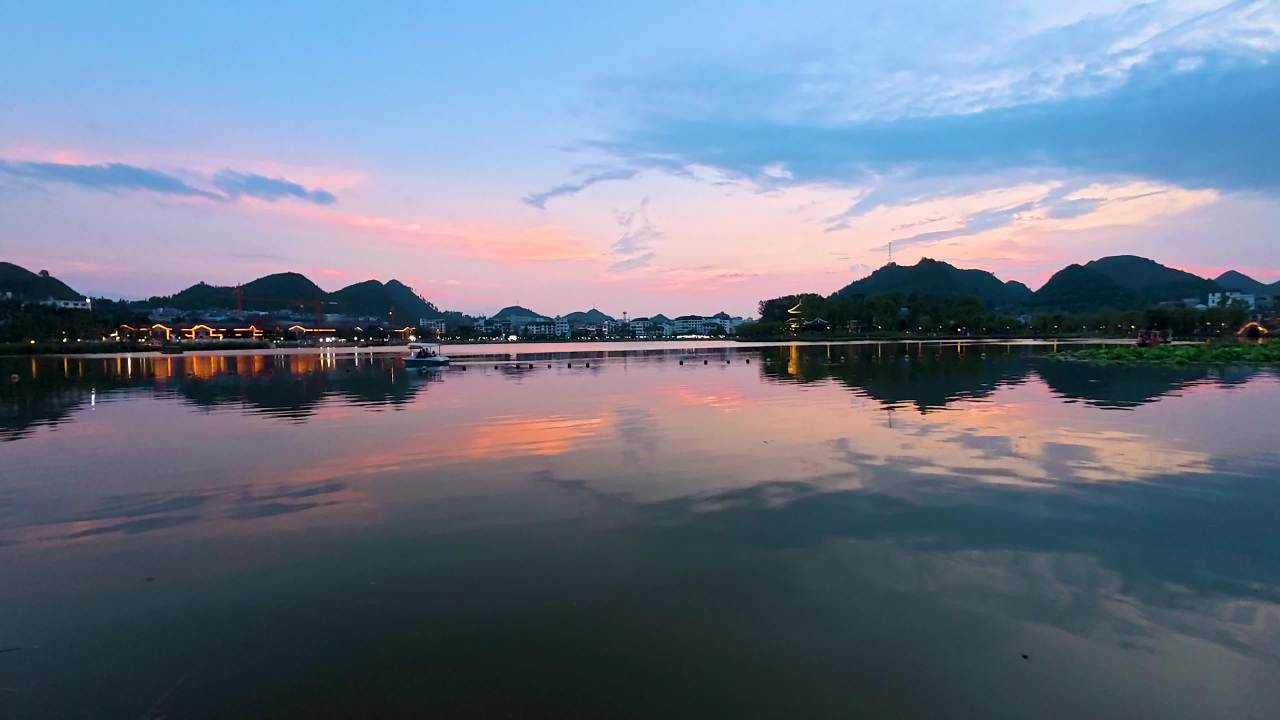 4k城市湖边日落水波波浪
