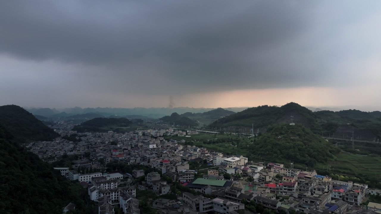 贵州安顺平坝喀斯特地貌城市高铁列车航拍