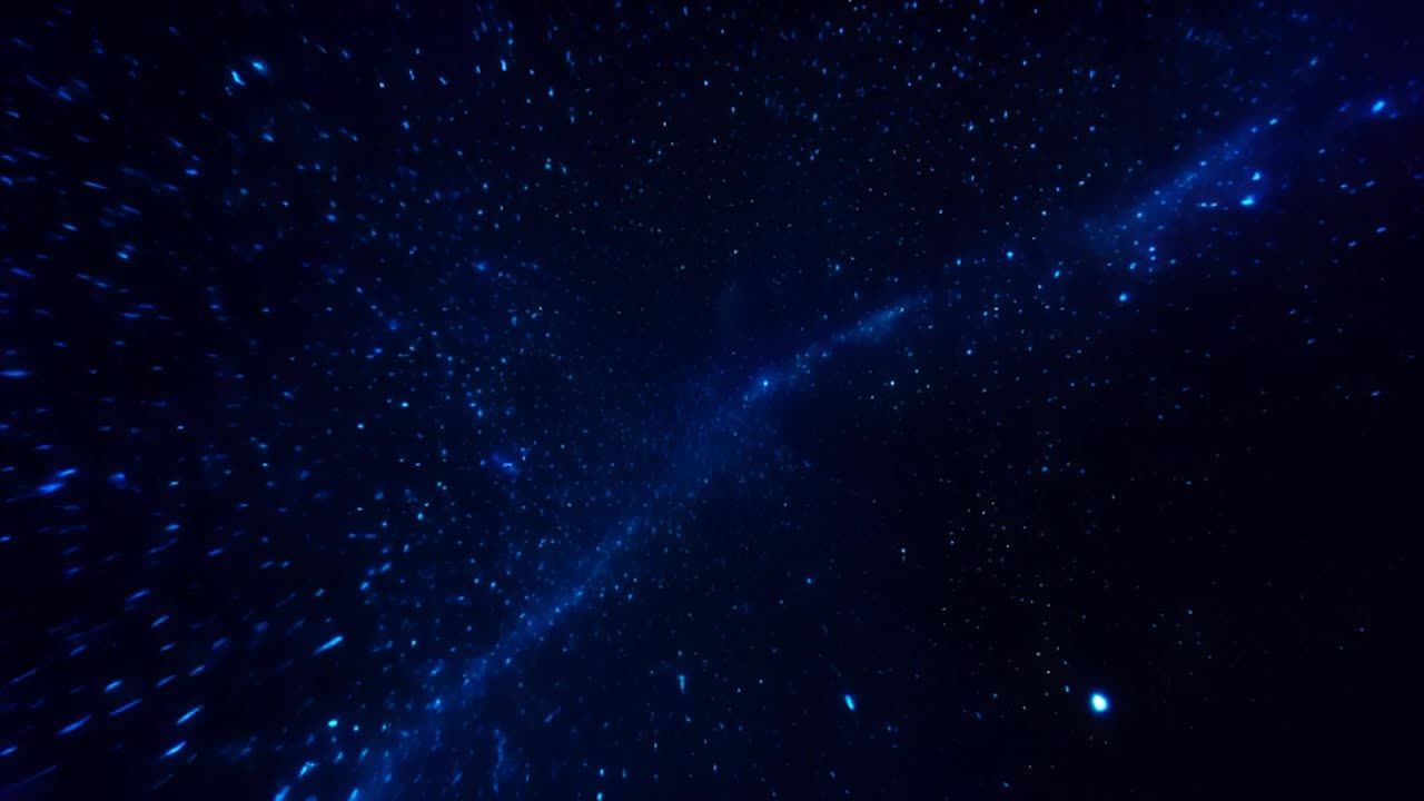 深蓝色的背景上，无数蓝色星星闪烁。镜头从高角度拍摄