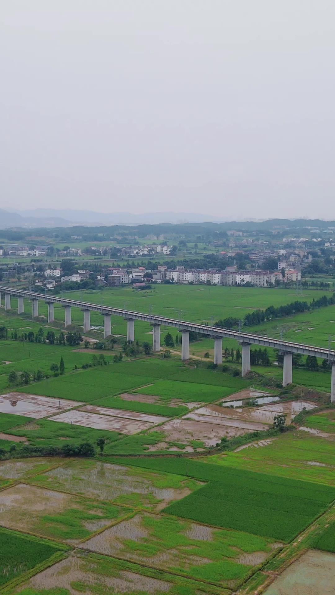 航拍田园中的高速公路高铁轨道