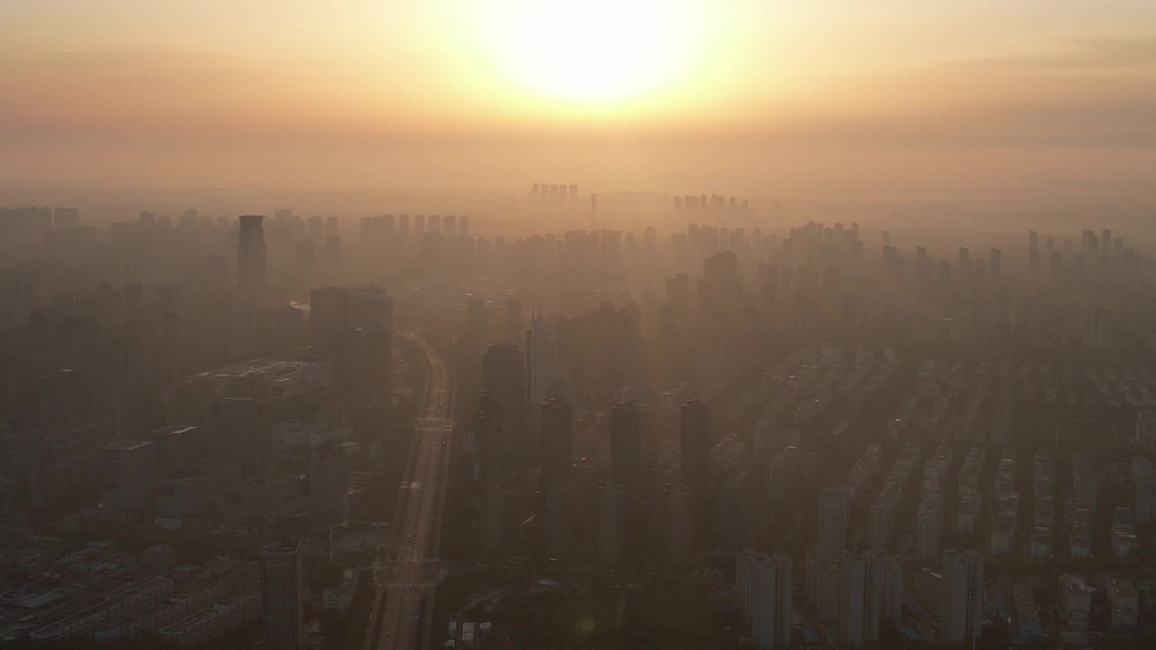 高楼迷雾清晨日出河南许昌航拍