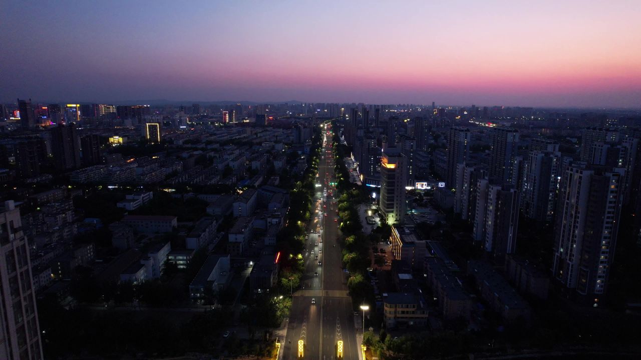 山东潍坊城市晚霞夜幕降临夜景灯光交通航拍 