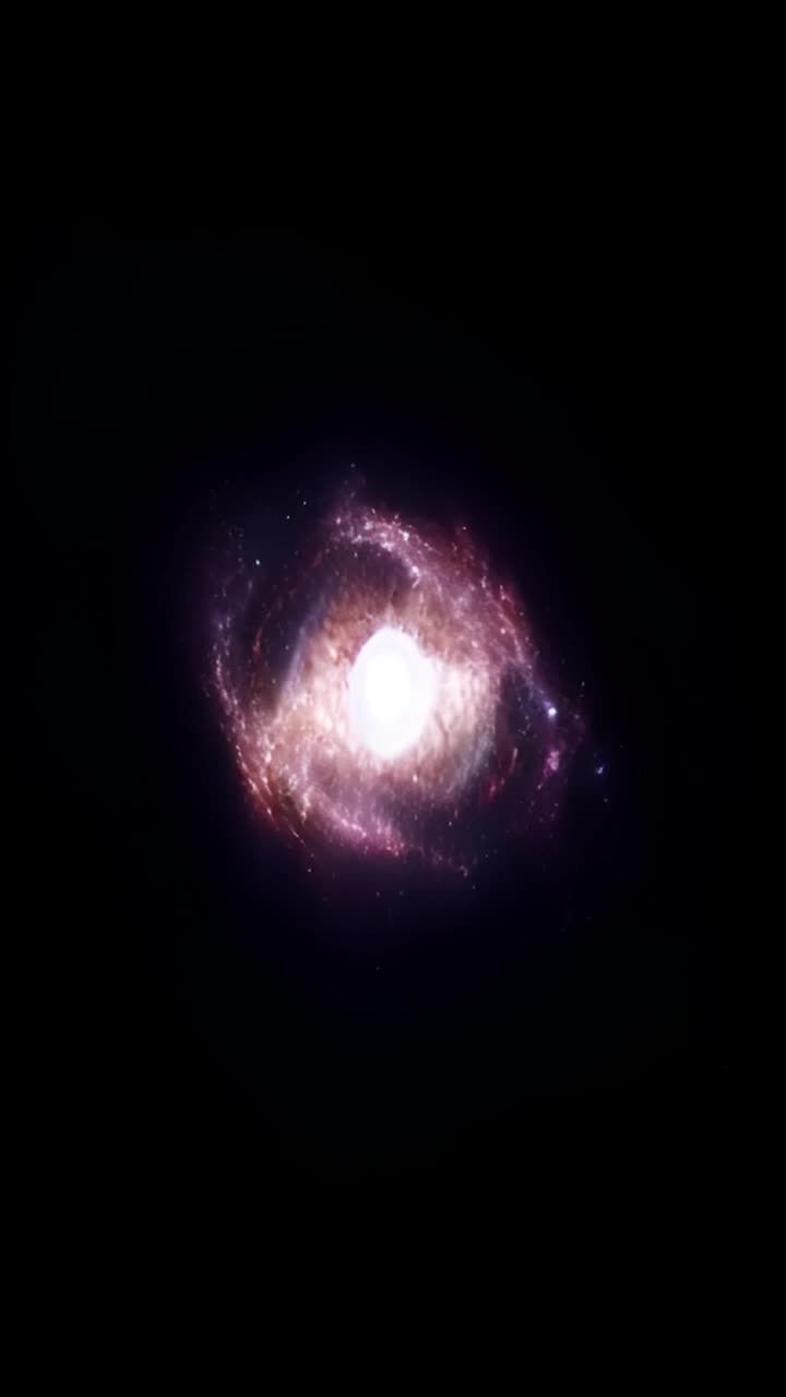 黑色背景中，中心有一个发光的圆形星云状物体，它呈现