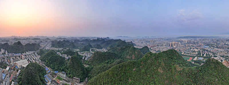 广西柳州城市清晨日出航拍全景图 