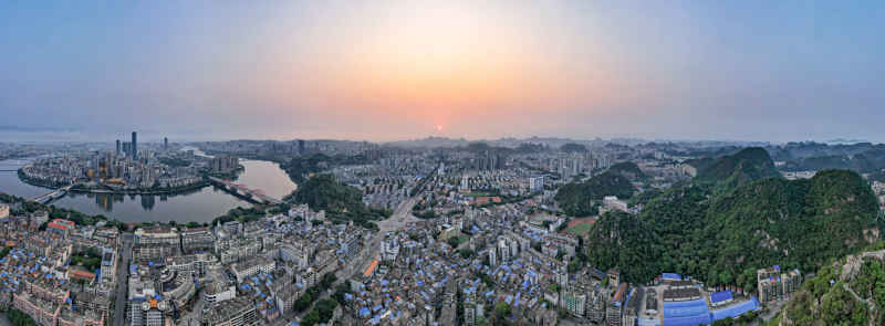 广西柳州城市清晨日出航拍全景图 