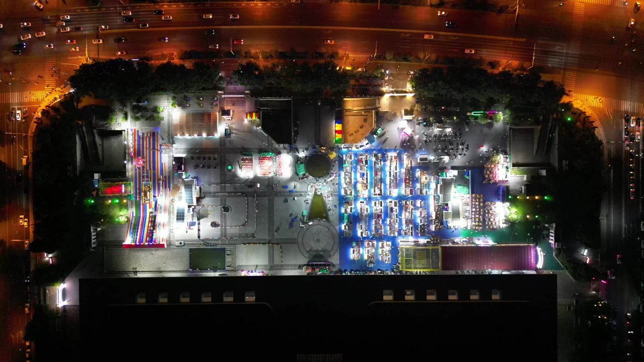 航拍山东泰安会展中心夜市夜景