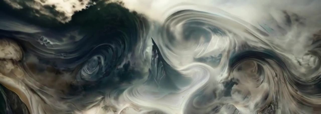 山峰伫立在画面中心，被流动着的云雾环绕。云雾呈现出