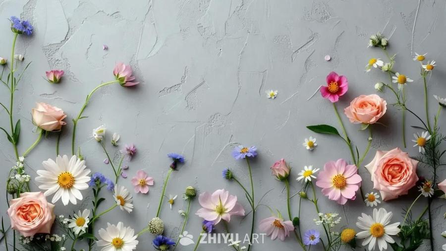 在灰色的背景上，盛开着各种颜色的花朵，包括玫瑰、雏